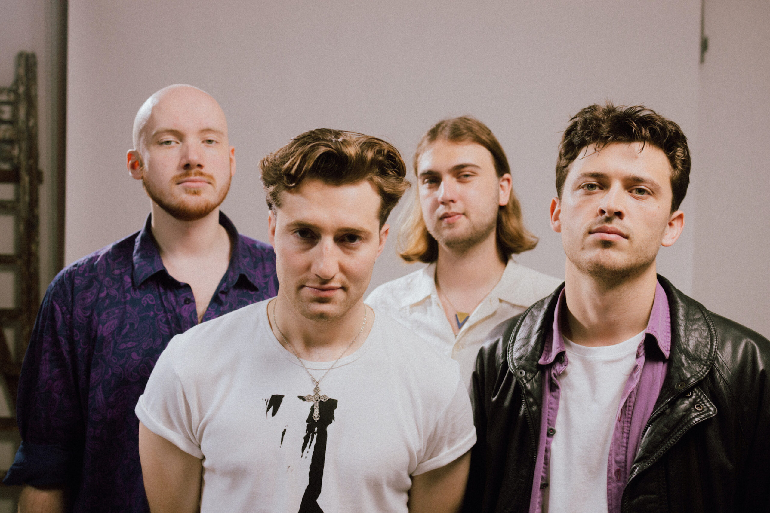 A group picture of all four members of THE FAT STACKS.