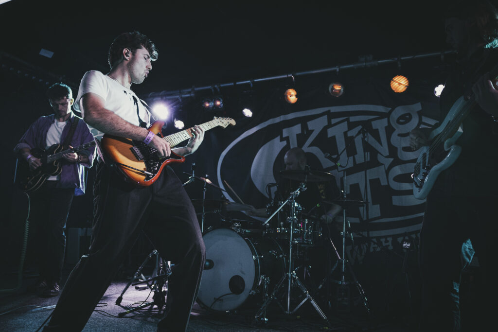 A live performance of The Fat Stacks on stage.