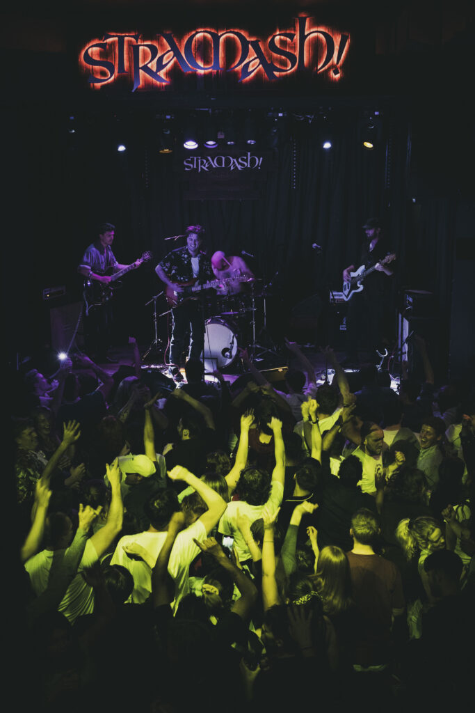 A live performance of The Fat Stacks on stage.