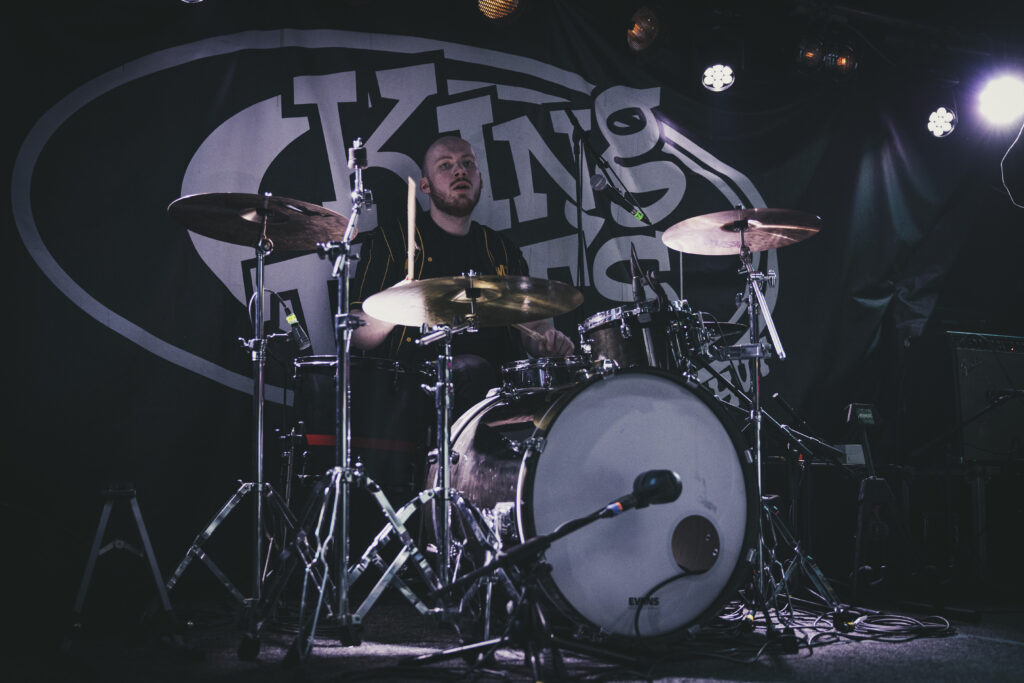 A live performance of The Fat Stacks on stage.