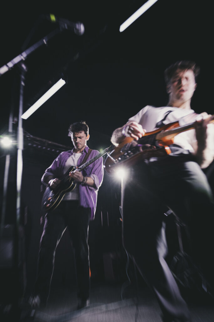 A live performance of The Fat Stacks on stage.