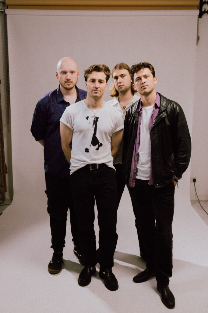 A group picture of all four members of THE FAT STACKS.